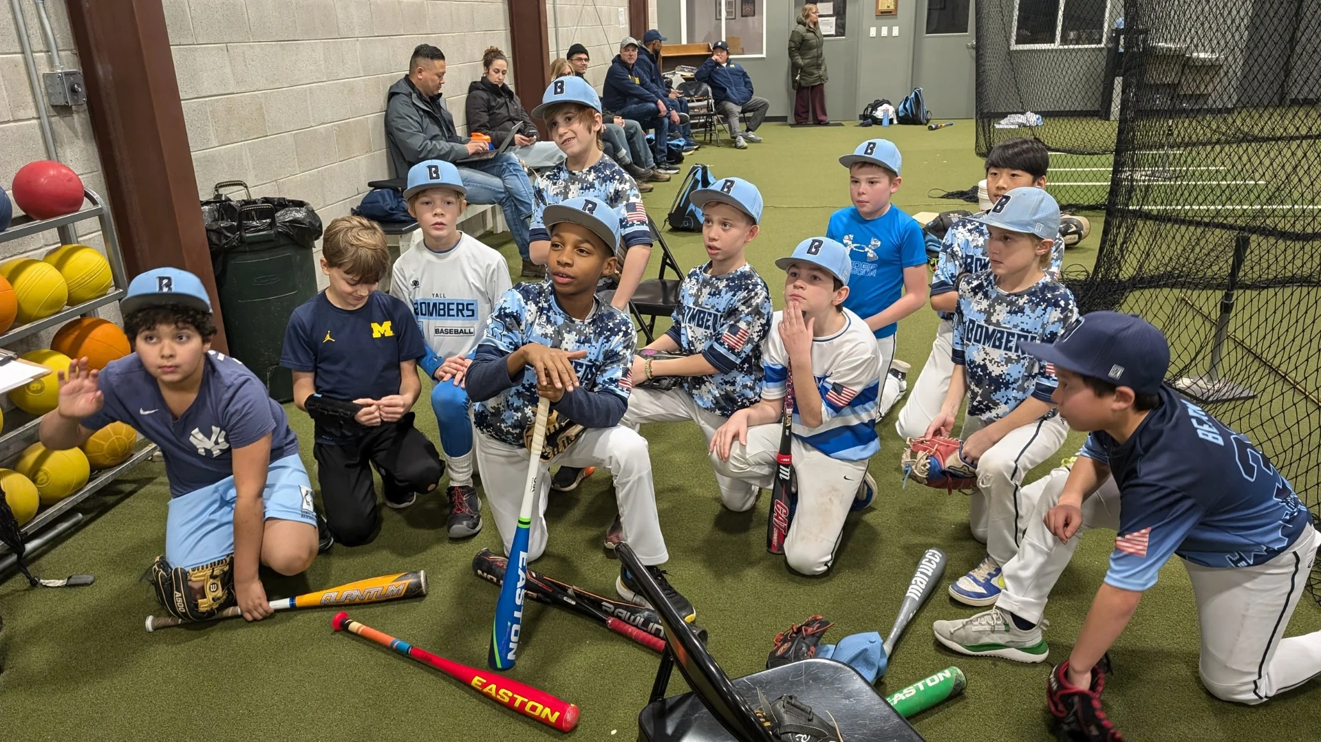 Bombers players gathered together during indoor practice